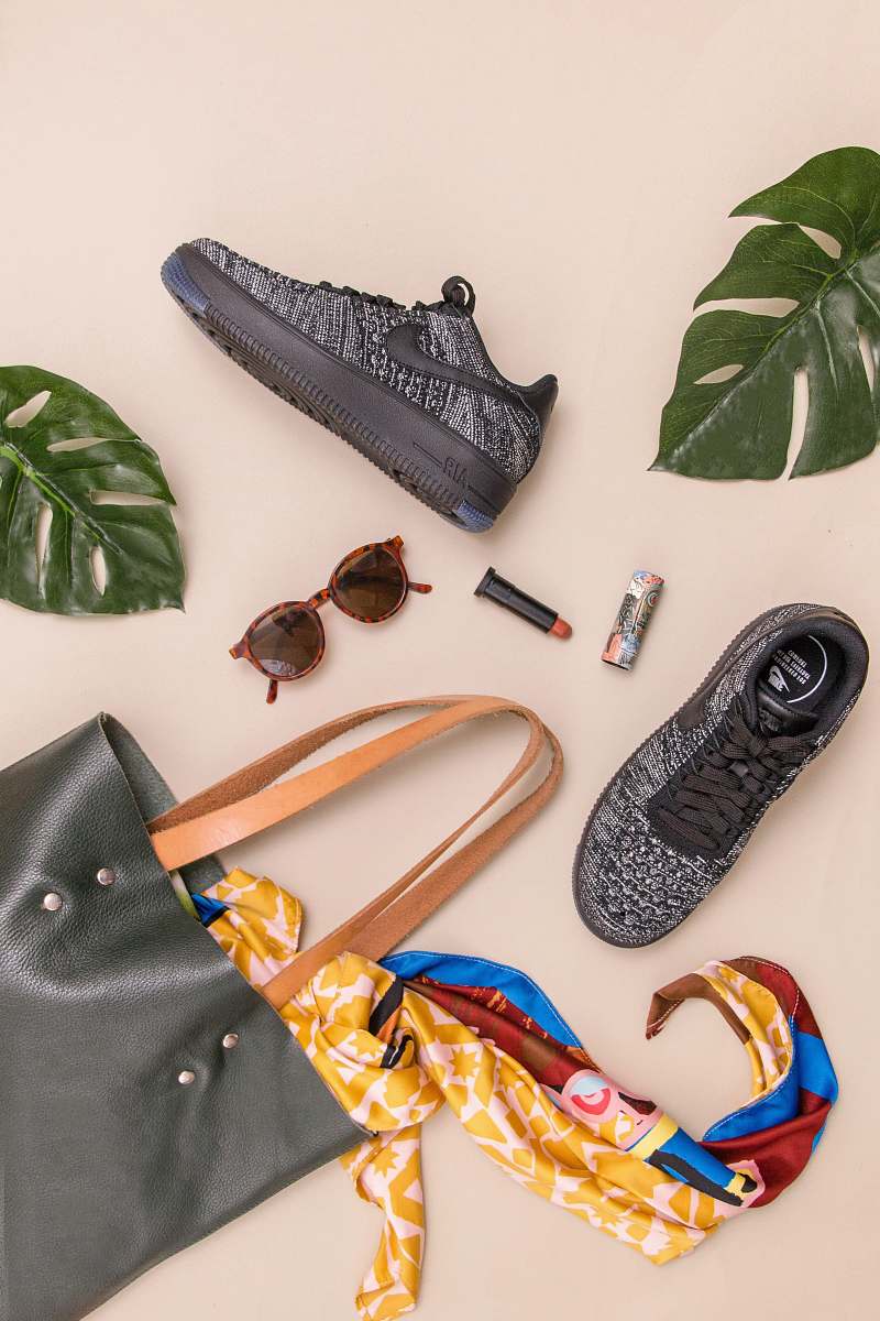 mexico city photo of bag, sneakers, and sunglasses on beige surface mexico